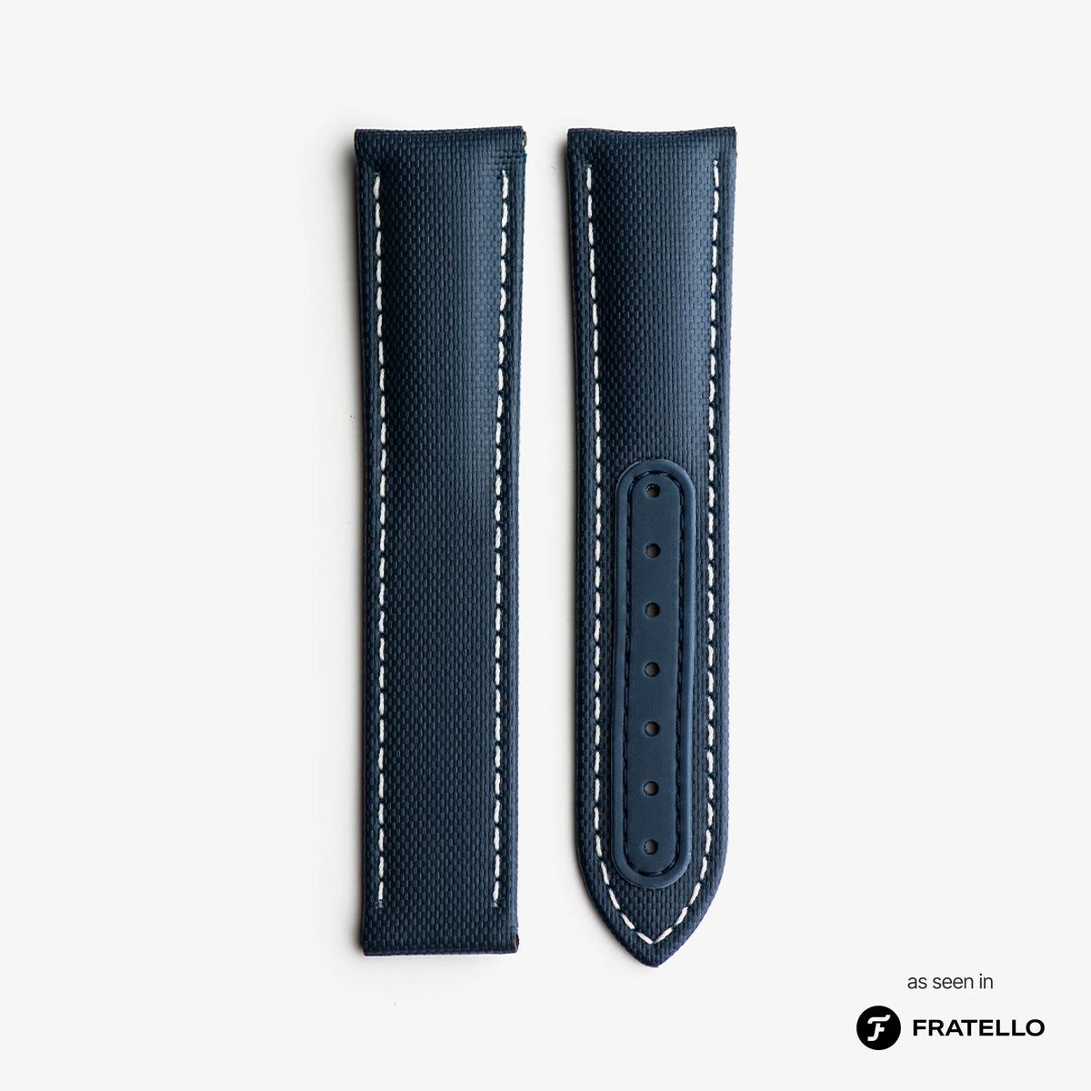 Blue leather watch strap with white stitching on a light gray background, branded 'Fratello'.