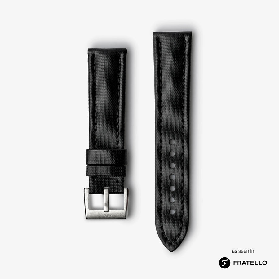 Black watch strap with silver buckle on a white background
