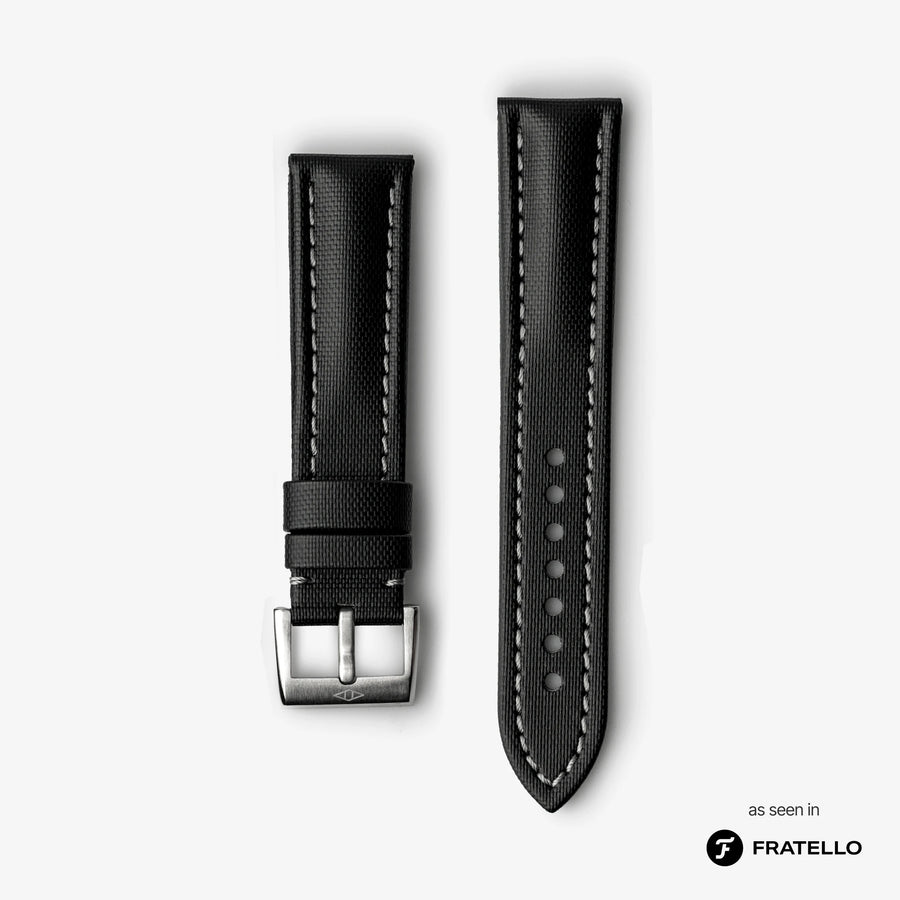 Black watch strap with silver buckle on a light gray background, branded 'Fratello'.