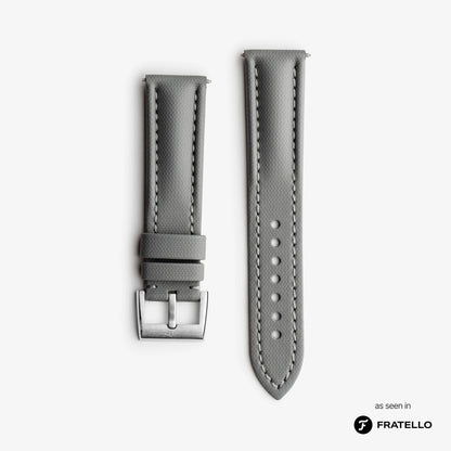 Gray watch strap with silver buckle on a white background, branded 'Fratello'.
