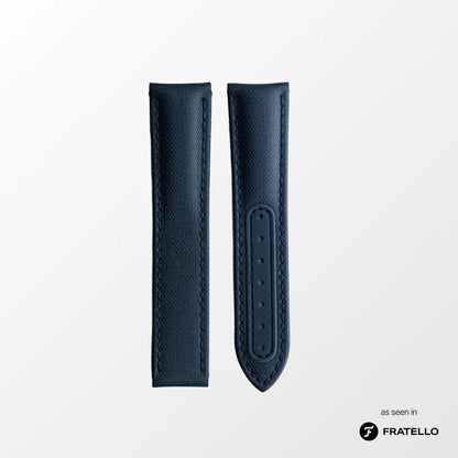 Blue leather watch strap on a light gray background with 'Fratello' branding.