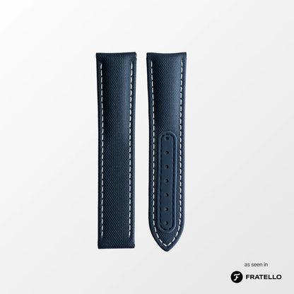 Blue leather watch strap with white stitching on a light gray background, branded 'Fratello'.