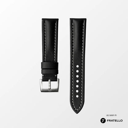 Black watch strap with silver buckle on a light gray background, branded 'Fratello'.