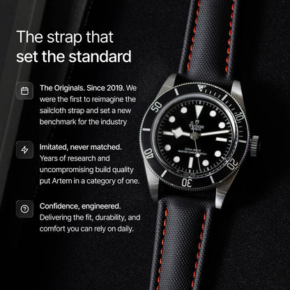 Watch with black sailcloth strap on a dark background, featuring text about the strap's features.