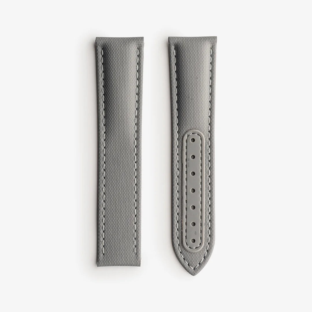 Gray watch strap with stitching detail on a white background, branded 'Fratello'.