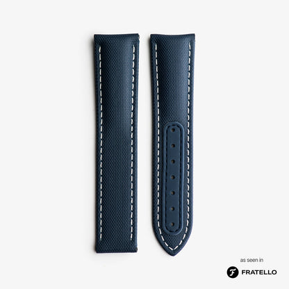 Blue leather watch strap with white stitching on a light gray background, branded 'Fratello'.