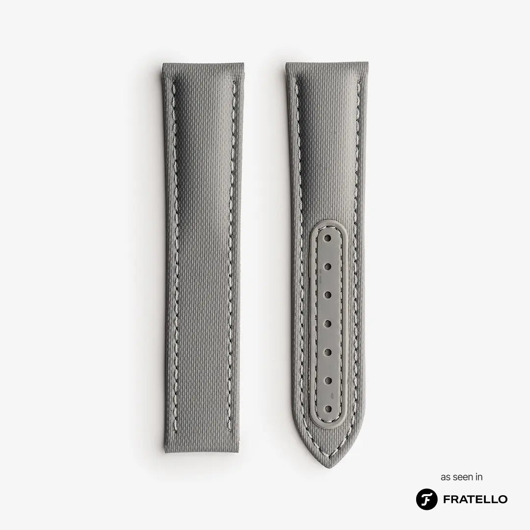 Gray watch strap with stitching detail on a white background, branded 'Fratello'.