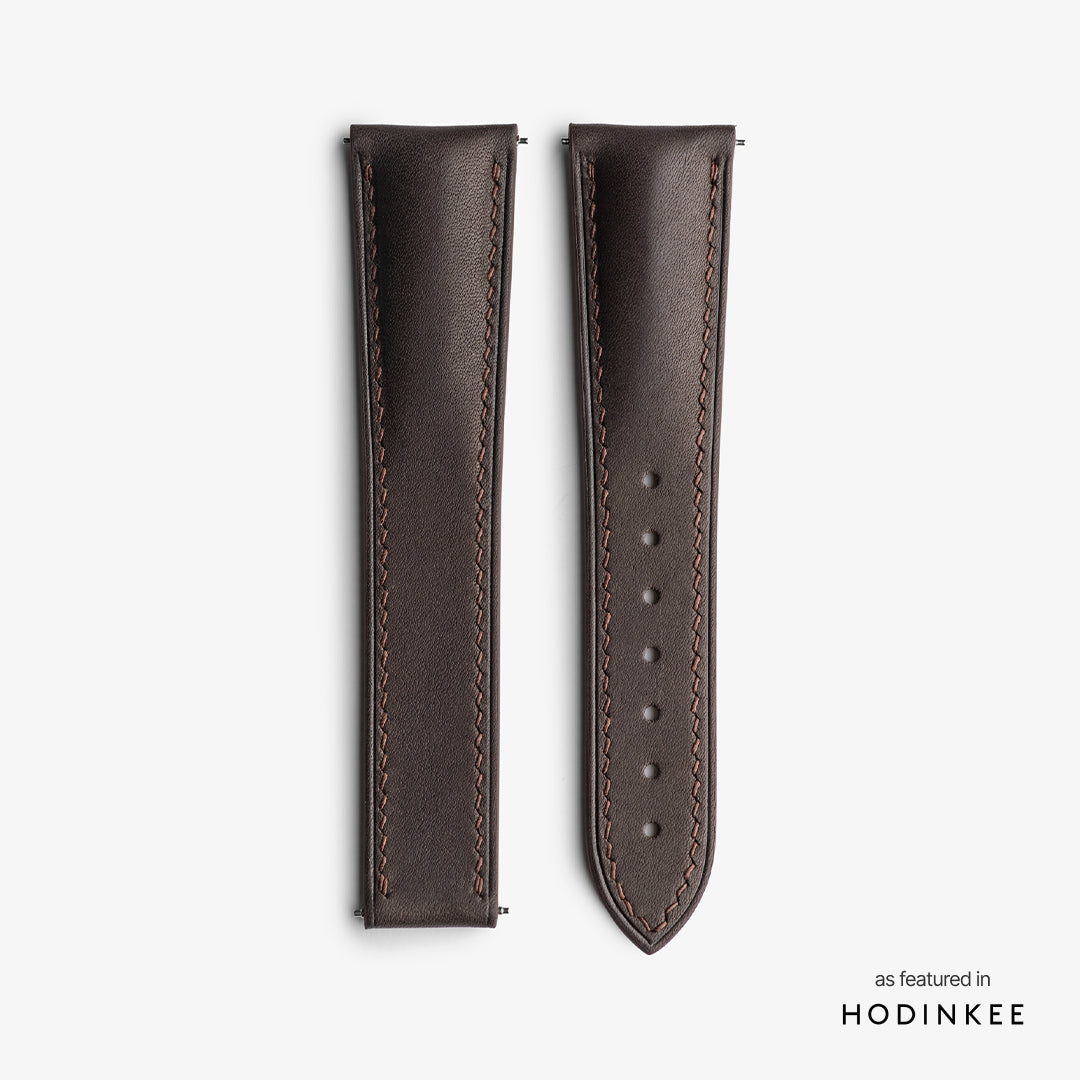 Brown strap on a textured leather surface