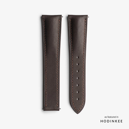 Brown strap on a textured leather surface